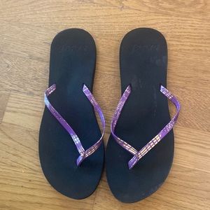 Reef Black Purple and Gold Flip Flops